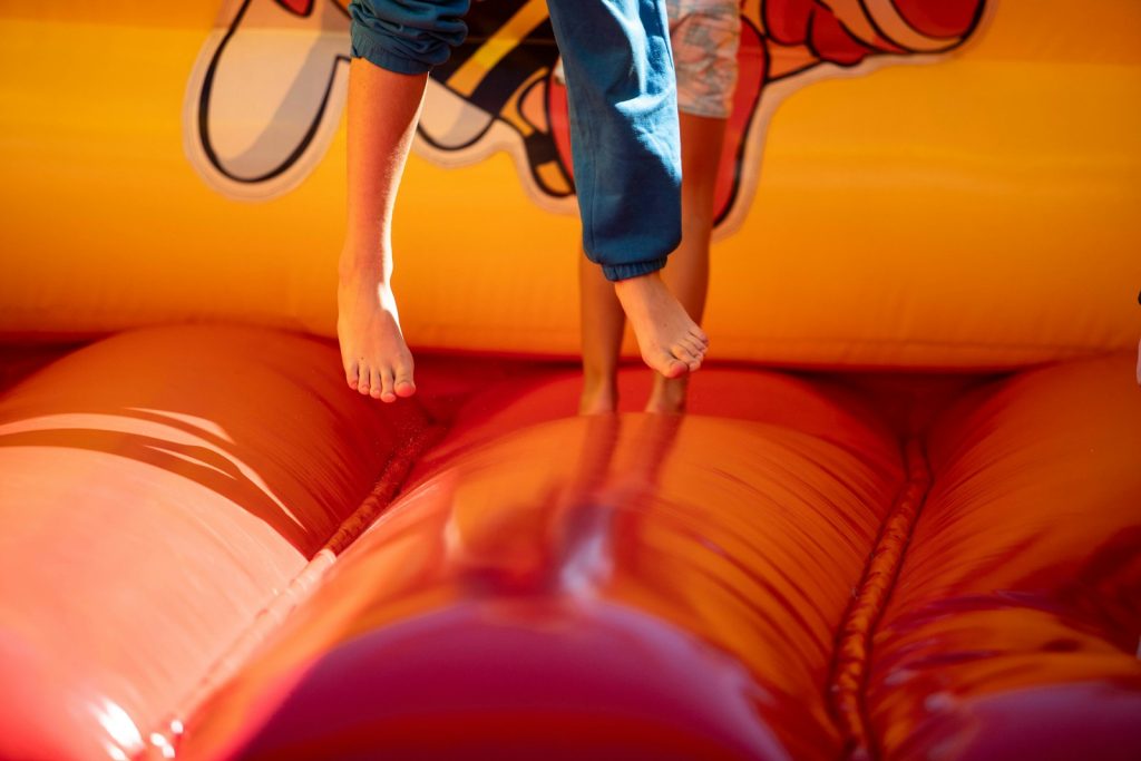 Alquileres Cabrero en Murcia A young boy jumping on a bouncy castle
